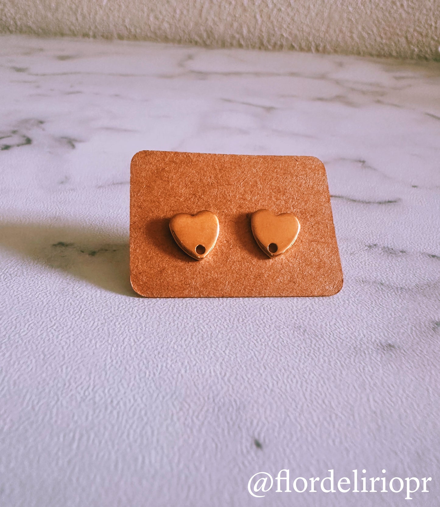 Gold heart stud earrings